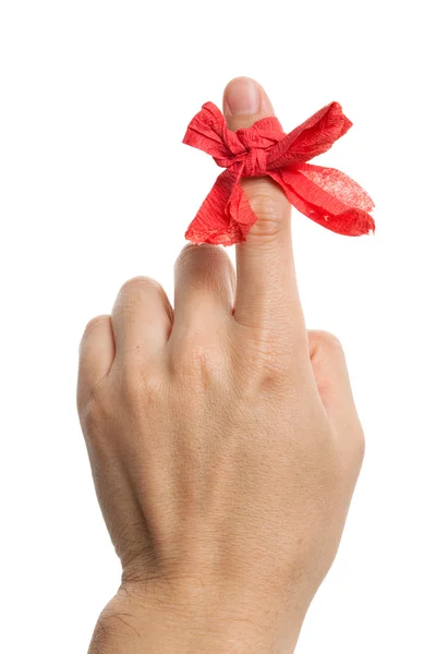Czerwona kokarda na palec — Zdjęcie stockowe