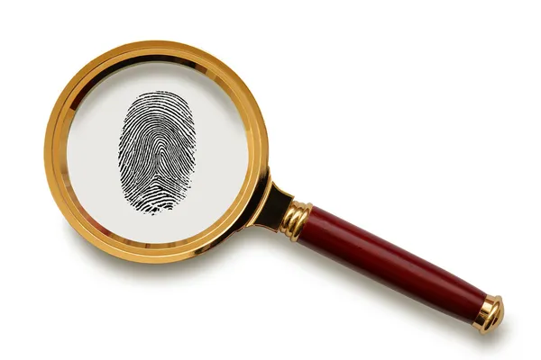 Magnifying glass with fingerprint. — Stock Photo, Image