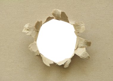 Hole in the cardboard. clipart