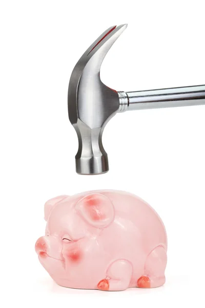 Hammer going to smash pink piggy bank. — Stock Photo, Image