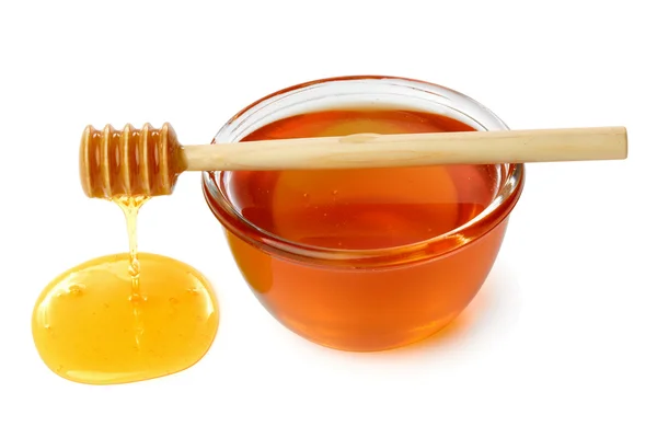 Wooden dipper with bowl of honey. — Stock Photo, Image