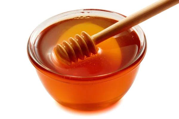 Trä skopa med skål med honung. — Stockfoto