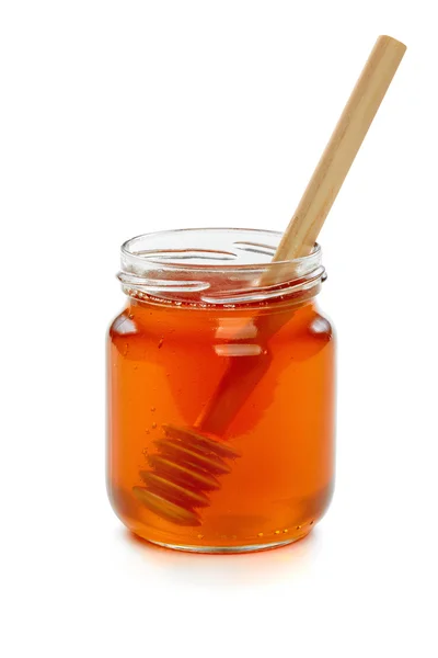 Dřevěná naběračka s jar medu. — Stock fotografie