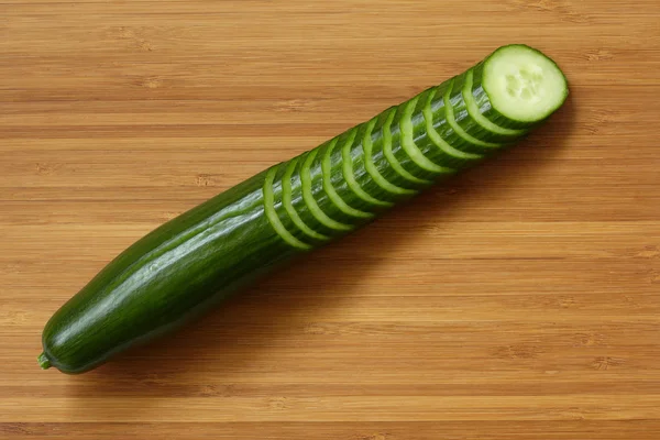 Cucumber on cutting board. — Stock Photo, Image