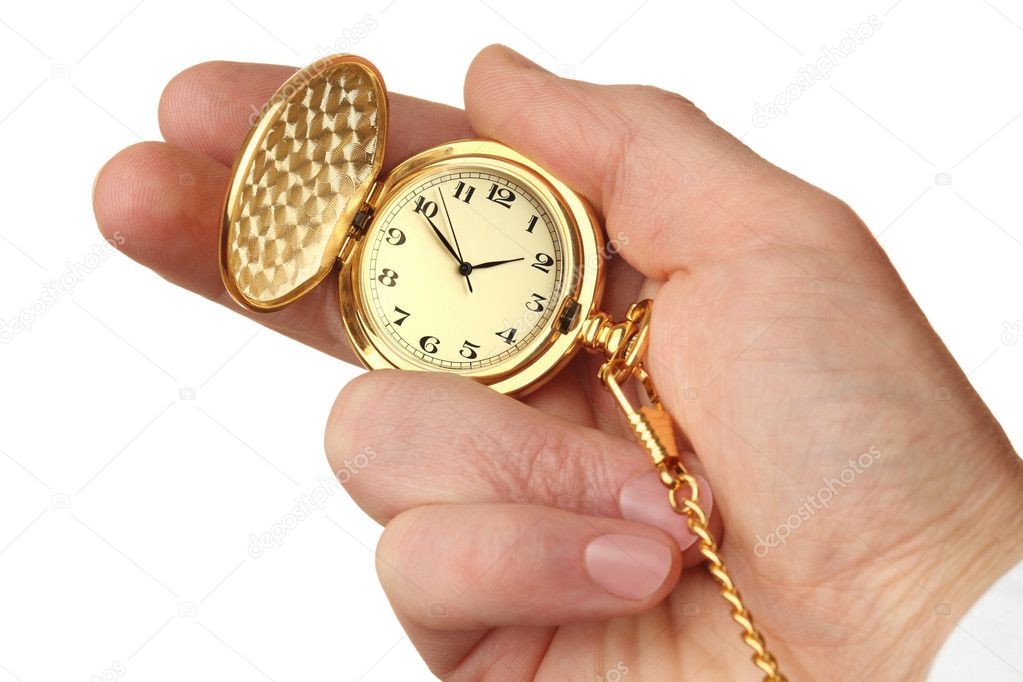 Golden pocket watch in a businessman's hand.