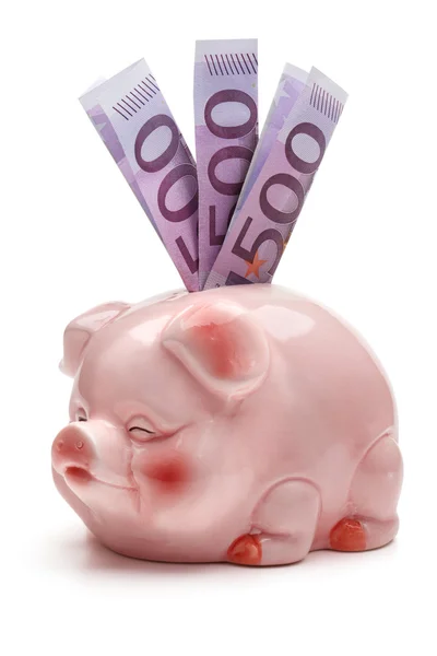 Pink piggy bank with five hundred euro banknotes. — Stock Photo, Image