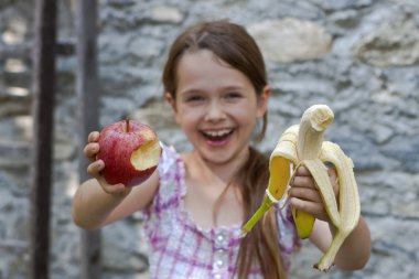 Girl is eating fruits clipart