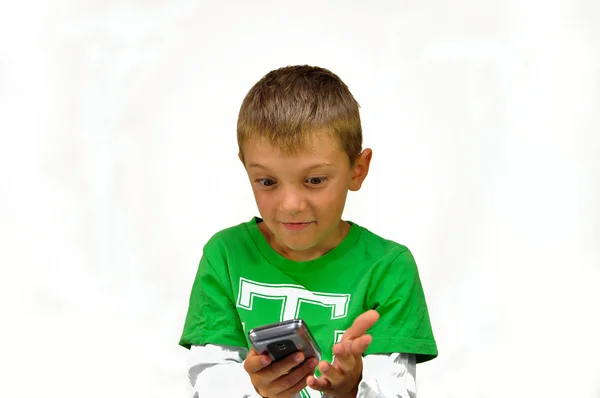Suprised young boy with mobile phone, cell phone, — Stock Photo, Image