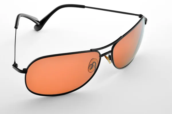 Orangefarbene Sonnenbrille. Stockbild