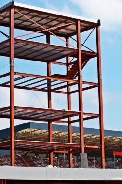 Steel Structure and Construction crane set against a blue sky clipart