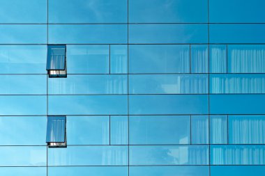 Reflection in an office building glass wall clipart