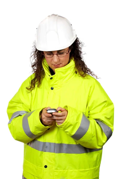 Pracownik budowlany kobiece Wyślij sms — Zdjęcie stockowe