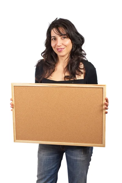 Příležitostné žena držící prázdný corkboar — Stock fotografie