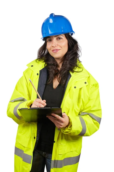 Vrouwelijke bouwvakker schrijven — Stockfoto