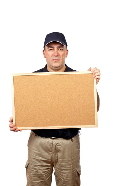 Futár tartja az üres corkboard — Stock Fotó