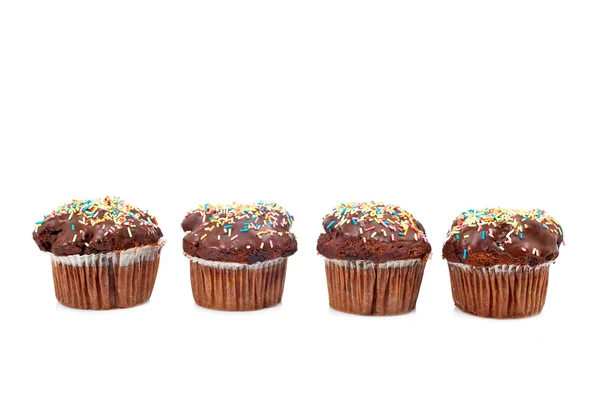 Vier smakelijke muffin met chocolade — Stockfoto