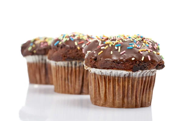 Drie smakelijke muffin met chocolade — Stockfoto