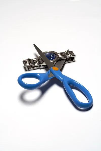 Cutting clok with scissors — Stock Photo, Image