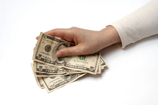 Hand som håller fan av amerikanska pengar — Stockfoto