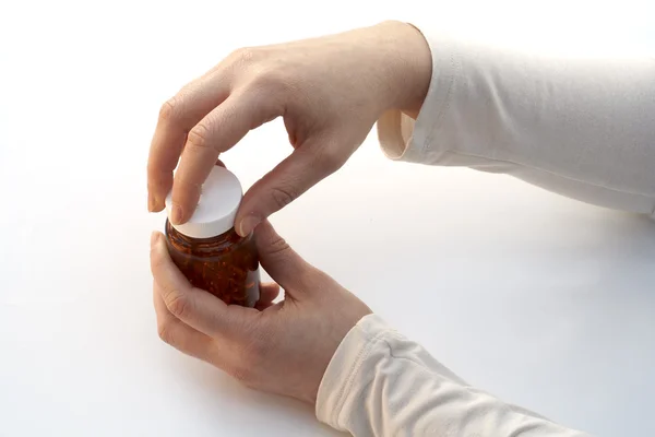 Opening a medicine bottle — Stock Photo, Image