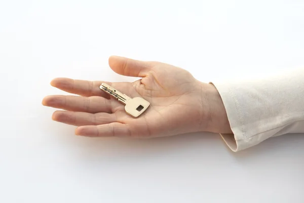Ключ на руке — стоковое фото