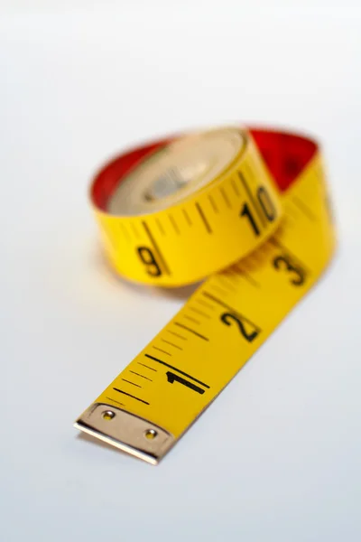Yellow tape measure macro, isolated on white background — Stock Photo, Image