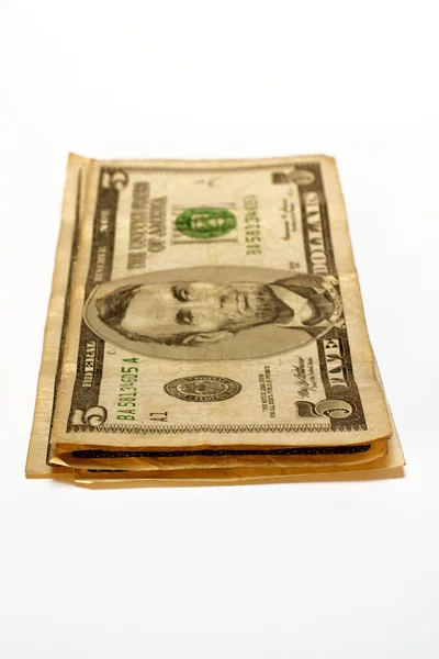 Στοίβα τους λογαριασμούς δολαρίων, που απομονώνονται σε λευκό φόντο — Φωτογραφία Αρχείου