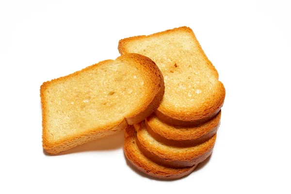 Algunas rebanadas de pan tostado aisladas sobre fondo blanco —  Fotos de Stock