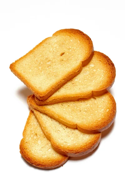 Algumas fatias de pão tostado isolado no fundo branco — Fotografia de Stock