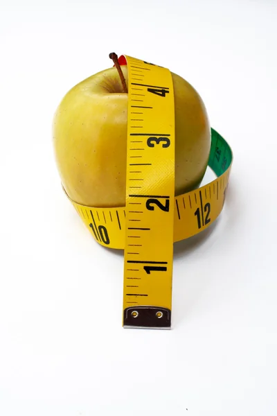 Amarelo Apple com fita métrica — Fotografia de Stock