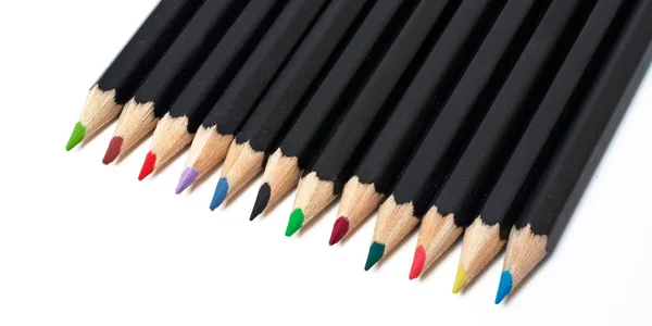 Gekleurde school potloden gestapeld — Stockfoto