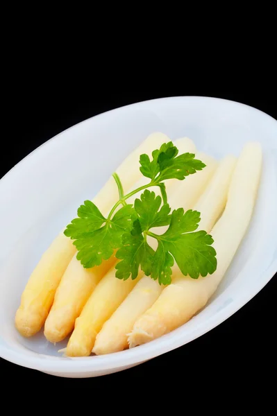 Asparagus under parsley — Stock Photo, Image