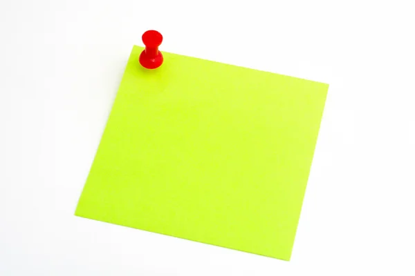 Isolated green paper with red pushnail — Stock Photo, Image