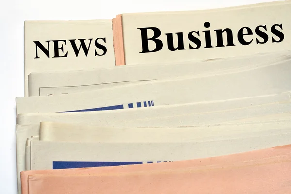 Stacked business newspapers — Stock Photo, Image