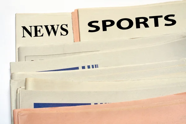 Jornais desportivos empilhados — Fotografia de Stock