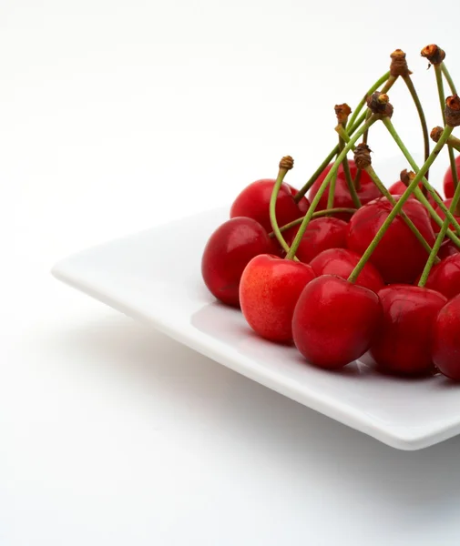 Cherries on the white plate — Stock Photo, Image
