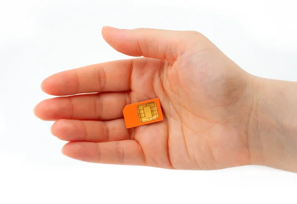 Hand som håller ett SIM-kort — Stockfoto