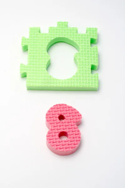 Number eight puzzle mats. Focus on the front (small DOF) — Stock Photo, Image