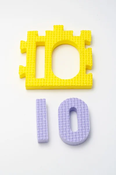 Nummer tien puzzel matten. Focus op de voorkant (kleine Dof) — Stockfoto