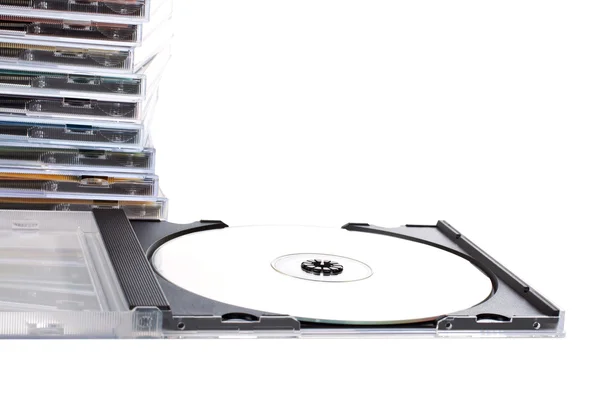 Caixa de CD aberta à frente da pilha de cds — Fotografia de Stock
