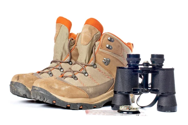 Hiking boots, compass and binoculars — Stock Photo, Image