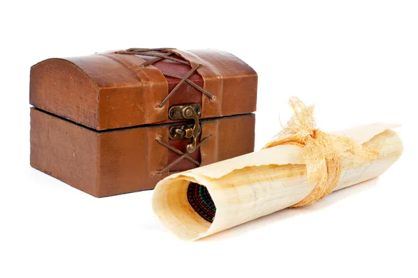 Treasure chest and papyrus scroll — Stock Photo, Image