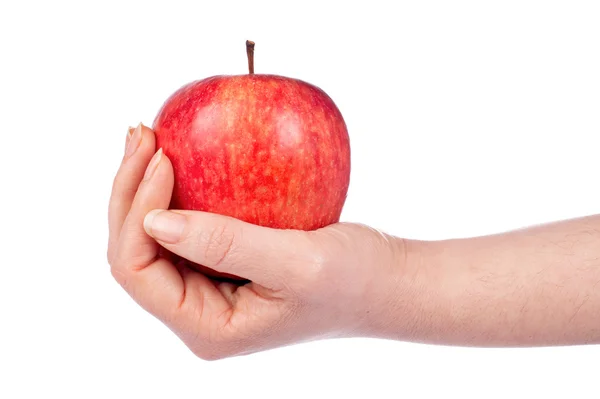 In der Hand einen roten Apfel — Stockfoto