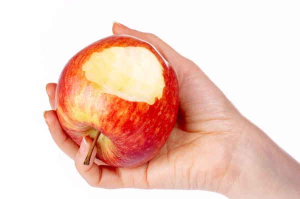 Biten rött äpple i handen — Stockfoto