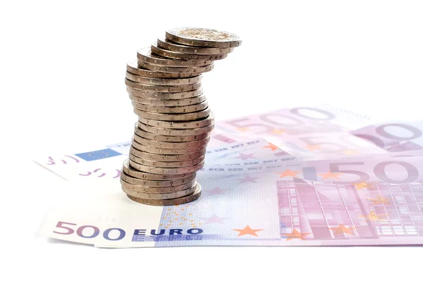Монеты и евро — стоковое фото