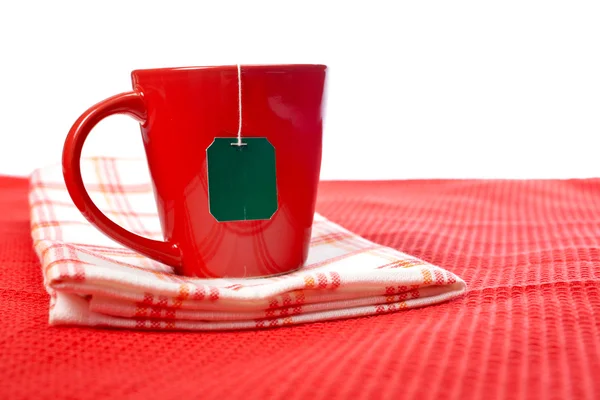 Xícara vermelha com saco de chá — Fotografia de Stock