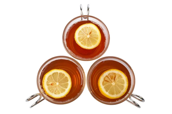 Tre tazze di tè di vetro con una fetta di limone — Foto Stock