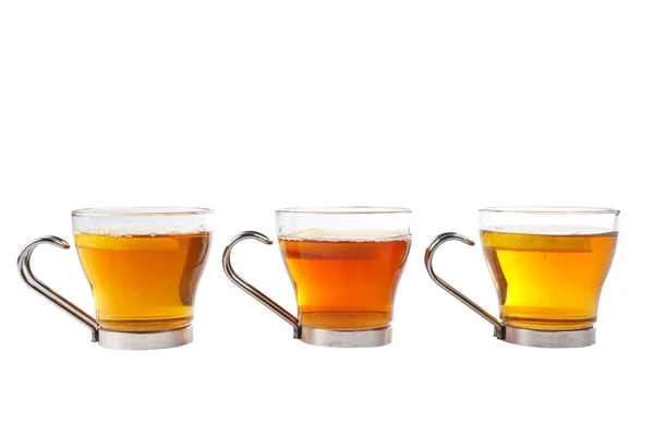 Três xícaras de chá com uma fatia de limão — Fotografia de Stock