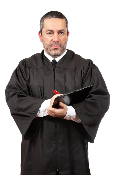 Serious male judge writing Royalty Free Stock Images