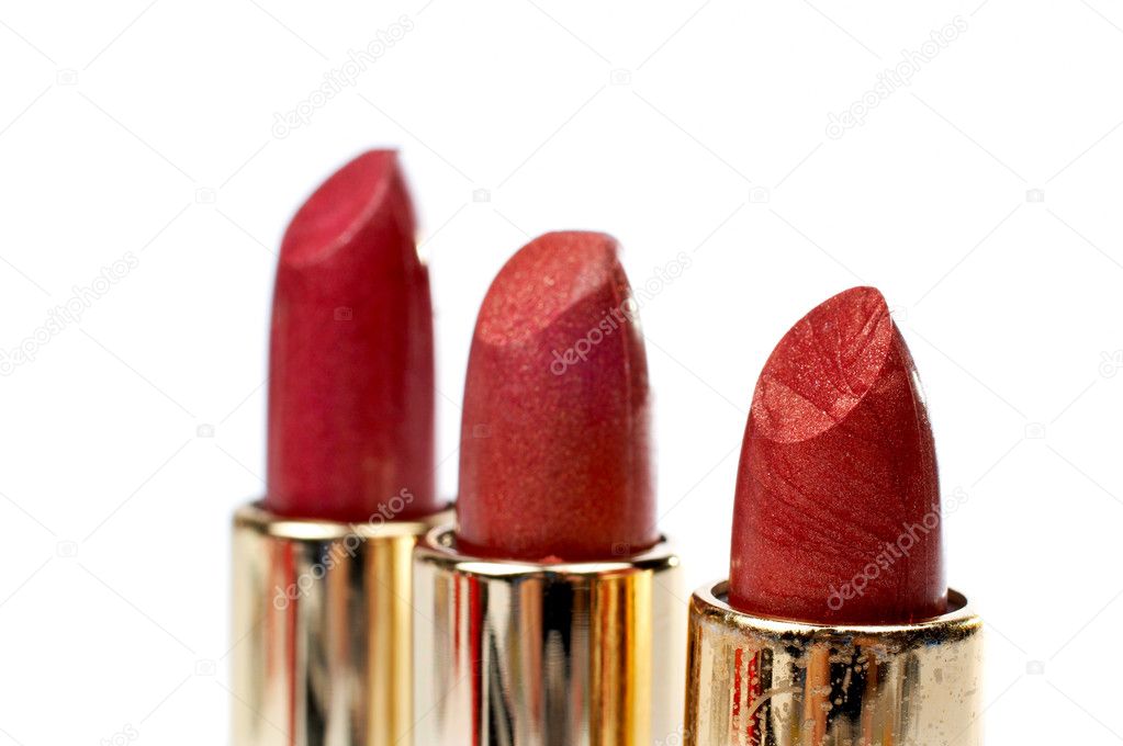 Three tubes of red lipstick — Stock Photo © broker 5883649